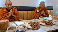 Buddhist Monks Eating at Thai Street Bar